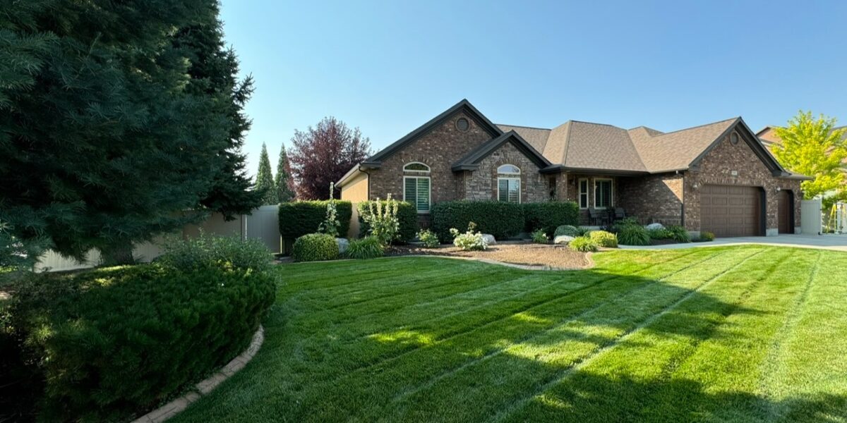 Beautiful home with lush green landscaping.